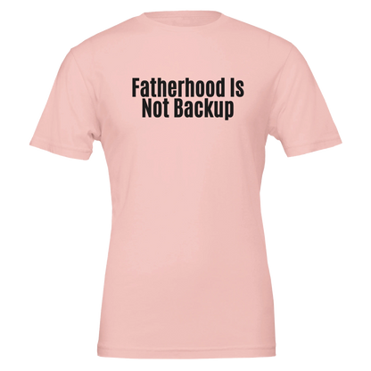 Flat lay of the “Fatherhood Is Not Backup” t-shirt in Soft Pink, front view.