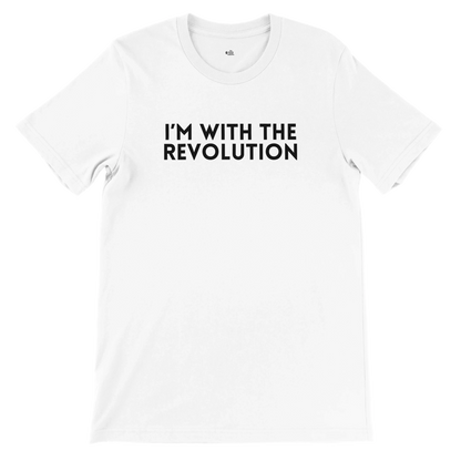 Flat lay of a white t-shirt featuring the phrase "I’m With The Revolution" in bold black text, from The Unfussy Thread Collective’s Premium Activist Tee collection.