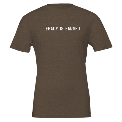 Flat lay of “Legacy Is Earned” t-shirt in heather brown with white text on the front.