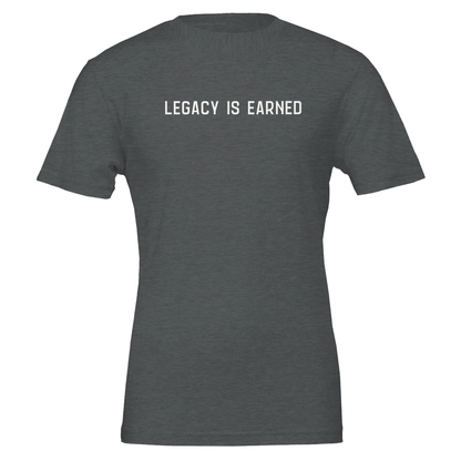 Flat lay of “Legacy Is Earned” t-shirt in heather dark grey with white text on the front.