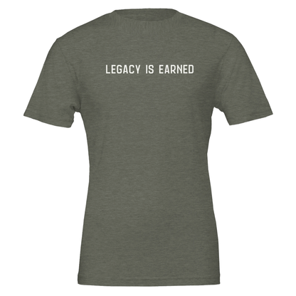 Flat lay of “Legacy Is Earned” t-shirt in heather olive with white text on the front.