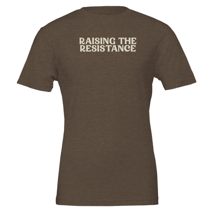 Flat lay of the “Raising the Resistance” t-shirt in Heather Brown with bold cream lettering, front view.