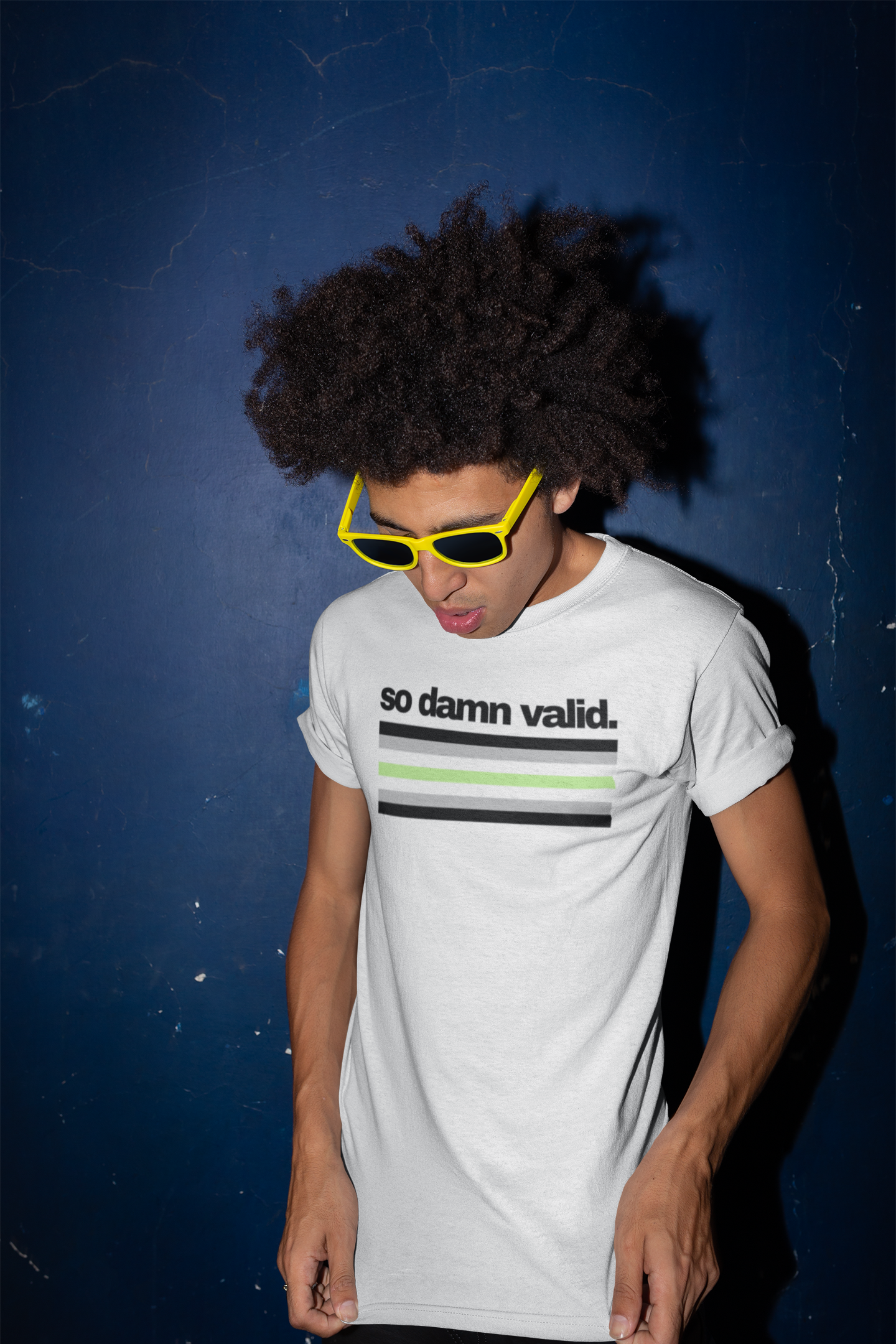 Unisex white t-shirt with the phrase "so damn valid." in black text above horizontal agender pride stripes in black, gray, white, and green.
