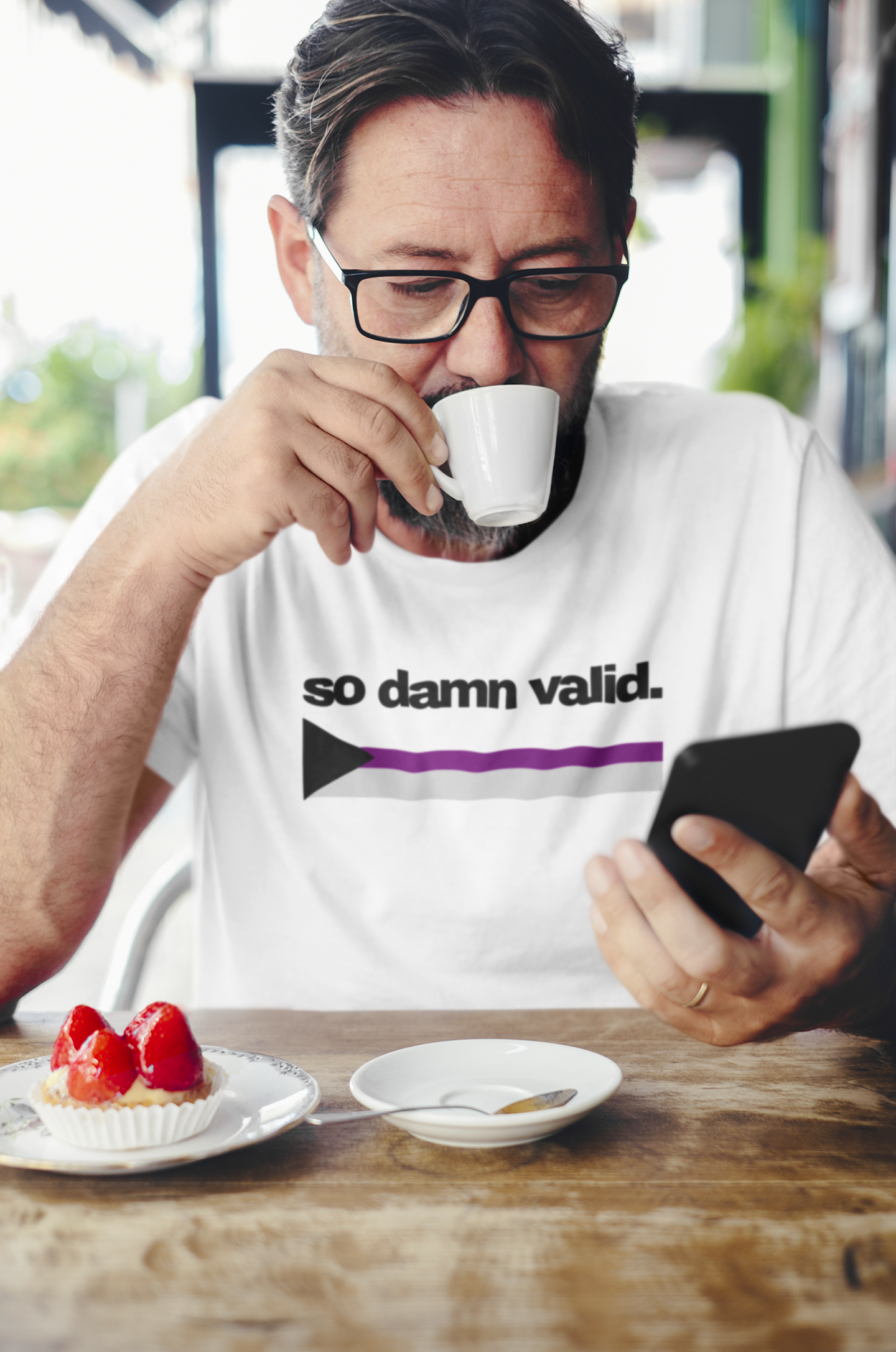 Unisex white t-shirt with the phrase "so damn valid." in black text above a demisexual pride flag arrow in black, gray, white, and purple.