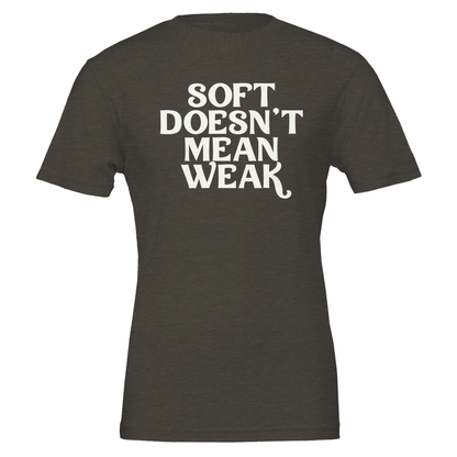Flat lay of military green t-shirt featuring the phrase “Soft Doesn’t Mean Weak” in white lettering.