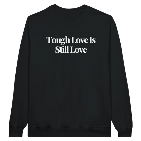 Tough Love Is Still Love midweight fleece crewneck sweatshirt in black with bold text design on front.