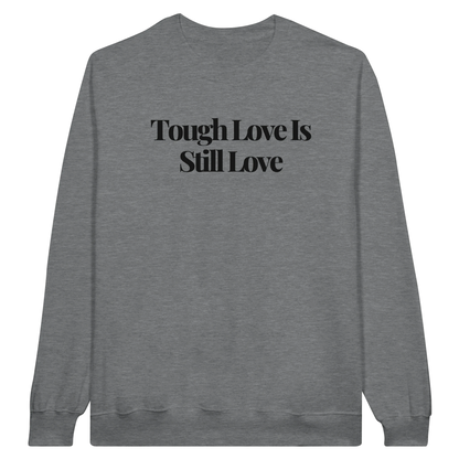 Tough Love Is Still Love midweight fleece crewneck sweatshirt in ring spun sports gray with bold text design on front.